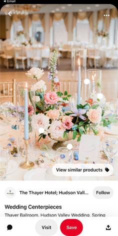 an image of a table setting with flowers and candles on the table for a wedding