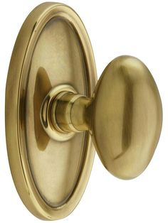 an antique brass door handle on a white background