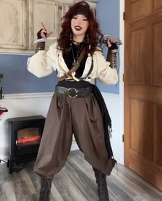 a woman dressed in pirate garb posing for the camera