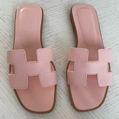 Hermes Oran Size 36 Color: Rose Porcelaine Brand New - Never Been Worn. Slight Marks On Bottom From Trying Them On On A Floor Not Carpet. Purchased At Hermes. Final Sale. Sold Out Everywhere! Unrealistic Wishlist, Hermes Sandals, Miami Trip, Hermes Oran Sandals, Luxury Sandals, Pink Slippers, Hermes Shoes, Hermes Oran, Pink Sandals