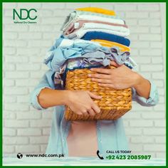 a woman is holding a basket full of clothes in front of her face, with the caption women's dry cleaning