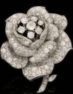 Queen Elizabeth II's Rose clip Brooch  Encrusted With Moissanite white Gold-Plated Brooch Pin metal purity:92.5 metal weight: 14.90 grams Stone: moissanite Stone Clarity: SI1-SI2 Stone cut: Excellent  Stone weight: 5.99 ct Stone shape shape: Round Brooch length: 2.2 inch Brooch Breadth: 1.6 inch Brooch finish: white gold plated over silver  > All products are made at our factory. so; you get the finest jewelry at factory prices without any extra cost of middlemen. > Pure 925 sterling silver jewe Bijoux Art Deco, Rose Leaf, Rose Brooch, Swedish Royals, Diamond Brooch, Royal Jewels, Royal Jewelry, Crown Jewels, Antique Diamond