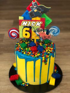 a birthday cake decorated with legos and candy