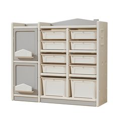 a large white cabinet with several bins on it