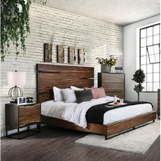 a bedroom with white brick walls and wood furniture, including a large bed in the center