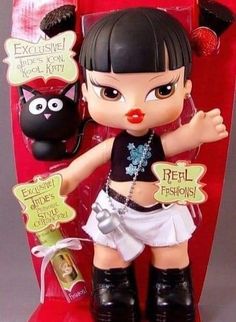 a doll with black hair and white shorts