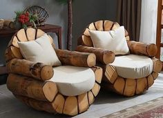 two wooden chairs made out of logs with white pillows on them, sitting in a living room