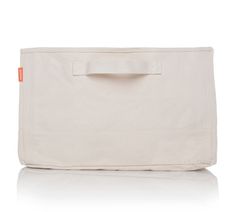 a white canvas bag with an orange tag on the front and side pocket for storage