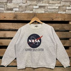 Vintage 90s Nasa Kenedy Space Center Sweatshirt Nasa Pullover Sweater Nasa Crewneck Jumper Nasa Kenedy Space Center Logo Graphic Print Grey Brand Name :- Tultex  📌 Tag Size :-  XLarge Youth  📌 Recommend Size :- Small Manual Measurement :- WIDTH (armpit to armpit) :- 20 inches / 51cm LENGTH (shoulder to end of garment) :- 21 inches / 53cm Condition :- Good Condition 7/10. Minor Defect Stain Refer Picture. 📮FED EX / DHL EXPRESS = 3-6 business day arrived Vintage Sweater With Letter Print And Long Sleeves, Vintage Letter Print Winter Sweater, Vintage Letter Print Sweater For Winter, Vintage Long Sleeve Sweater With Letter Print, Retro Crew Neck Sweatshirt For Winter, 90s Crew Neck Winter Tops, 90s Long Sleeve Sweater With Letter Print, Vintage Relaxed Fit Letter Print Sweater, Vintage Relaxed Fit Sweater With Letter Print