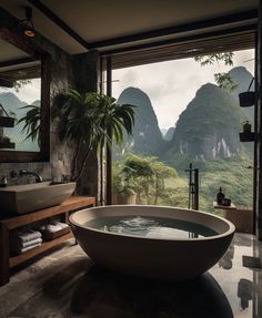 a large bathtub sitting in the middle of a bathroom next to a big window