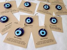 the evil eye necklaces are blue and have tags attached to them