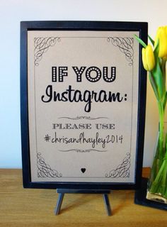 a vase filled with yellow tulips next to a sign that says if you instagram please use