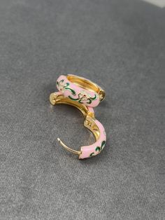 What's Inside 🎁: 1x pair of Gold Plated Pink Floral Multicolour Dainty Enamel Huggie Hoop Earrings  🌸🌸 Earring Size 📏:  2 cm (0.78 inches) 🌍📦Free worldwide shipping  🔒30-day money-back guarantee ️Handcrafted & Handmade  🌱🌿Style sustainability, choose eco-friendly 🙏 Your support fuels my dream of creating one of a kind, exquisite handcrafted jewelry.  💎 Every custom piece is a testament to my dedication, creativity and passion. Pink Enamel Hoop Earrings, Pink Enamel Hoop Jewelry, Small Hoop Enamel Earrings, Multicolor Enamel Hoop Earrings, Pink Flower Hoop Earrings, Green Enamel Hoop Earrings, White Enamel Hoop Earrings, Floral Hoops, Golden Earrings