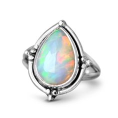 Unleash your inner fire with an opal teardrop ring, crafted from shimmering sterling silver. The delicate teardrop-shaped gem captures the light with its iridescent rainbow hues, making it the perfect addition to any jewelry collection*Our jewelry features natural, genuine gemstones, ensuring each piece is unique and one-of-a-kind. Please note that, as no two gemstones are identical, the jewelry you receive may vary from the photos.For wide-band rings, we recommend sizing up for the best fit.Mat Spiritual Opal Birthstone Ring, Adjustable Teardrop Moonstone Ring In Sterling Silver, Teardrop Opal Promise Ring Fine Jewelry, Teardrop Opal Promise Ring In Fine Jewelry Style, Silver Teardrop Opal Promise Ring, Silver Teardrop Rings With Spiritual Style, Silver Spiritual Teardrop Ring, Spiritual Silver Teardrop Ring, Silver Teardrop Opal Ring In Sterling Silver