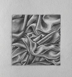 a black and white drawing of a cloth on a piece of paper with a square frame