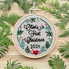 a cross stitch ornament with the words china's first christmas on it