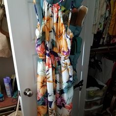 Floral Maxi Dress Sleeveless Multicolor Maxi Dress For Daytime, Multicolor Sleeveless Maxi Dress For Daytime, Casual Multicolor Maxi Dress For Daytime, Orange Tropical Print Maxi Dress For Spring, Spring Orange Maxi Dress With Tropical Print, Multicolor Sundress For Daytime, Yellow Long Dress For Vacation, Yellow Long Dress For Summer, Long Yellow Summer Dress