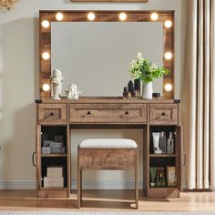 a wooden vanity with lights on it and a bench in front of the mirror,