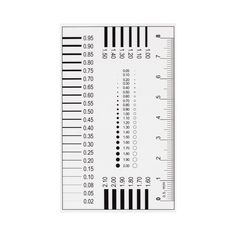 a white ruler with black and white numbers on it