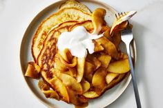 a plate with pancakes and french toast on it