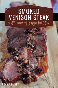 smoked venison steaks with cherry sauce butter on a wooden cutting board and text overlay reads smoked venison steaks with cherry sauce butter