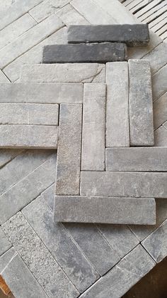 some bricks laying on top of each other in the middle of a flooring area