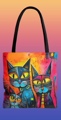 an image of two cats on a colorful background tote bag that is also available for purchase