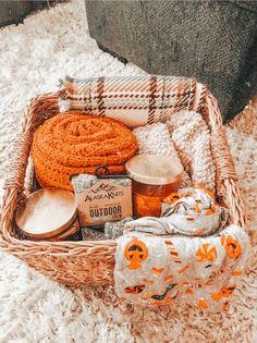 a wicker basket filled with lots of items on top of a white carpeted floor