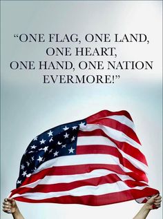 a person holding an american flag with the quote one flag, one land, one heart, one hand, one nation evermore