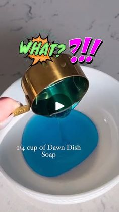 a person pouring blue liquid into a white bowl with the words what? on it