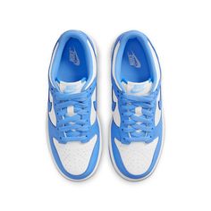 The Nike Dunk Low GS 'University Blue' is a sneaker that pays homage to its collegiate hardwood roots. This low-top shoe features a leather upper in a color-blocked design, with a crisp white base and pastel blue finish on the eyestay, Swoosh, and heel and forefoot overlays. Nike branding is featured on the tongue tag and heel tag, while the shoe sits on a durable rubber cupsole. The outsole provides performance-ready traction, making this sneaker perfect for big kids who want a stylish and functional sneaker. Carolina Do Norte, Unc University, Nike Models, Cute Nike Shoes, Cute Nikes, Swag Shoes, University Blue, Blue Nike, Nike Dunk Low