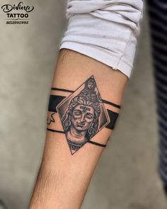 a man's arm with a tattoo on it that has an image of a woman