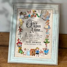 a frame with some pictures on it and the words, once upon time i'm baby shower