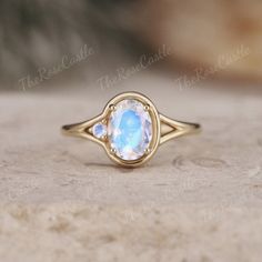 Unique Oval Moonstone Engagement Ring Vintage Solid Gold Moonstone Ring Round Moonstone Ring Vintage Women Wedding Anniversary Promise ring ITEM DETAILS ●Available in yellow, white or rose solid 10k, 14k or 18k gold. This ring can be made in Platinum. ❀❀Center Stone: Moonstone Shape: Oval shape Size: 6x8mm Side Stone: Moonstone Shape: Round shape Band width about 1.5mm Visit my shop for more jewelry: https://www.etsy.com/shop/TheRoseCastle if you would like to customize your unique ring, you may contact us about your ideas and pictures. Hope I could get the chance to create fabulous rings for you! ❀Production ---- This ring is handmade and very good quality! Please allow 2-4 weeks for production. It can be made to any ring size.  ❀Engraving service We accept the engraving order, leave a no Luxury Vintage Moonstone Oval Cabochon Ring, Oval Cabochon Moonstone Ring For Wedding In Yellow Gold, White Oval Moonstone Ring With Celestial Style, White Oval Moonstone Celestial Ring, White Oval Celestial Moonstone Ring, Yellow Gold Oval Moonstone Ring, Celestial Oval Gemstone Rings, White Oval Celestial Ring, White Oval Celestial Rings