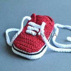 a crocheted red and white tennis shoe ornament