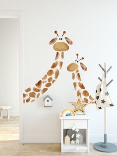 a giraffe wall sticker in a child's room with toys and decor