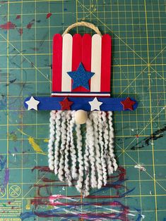 a red, white and blue patriotic decoration on a cutting board