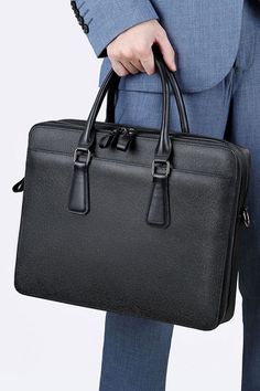 Introducing the Genmarks Deluxe Office Bag - the epitome of sophistication and practicality. Made with premium full-grain real leather, this office bag is built to last and exude a sense of elegance. The sleek and professional design of the bag makes it perfect for carrying all your work essentials, whether you're heading to the office or a business meeting. The spacious interior and multiple compartments allow you to keep your documents, laptop, and other essentials organized and easily accessi High-end Business Shoulder Bag Briefcase, High-end Business Briefcase Shoulder Bag, High-end Business Bags, High-end Briefcase With Top Carry Handle For Office, High-end Rectangular Bags For Work, High-end Office Briefcase With Top Carry Handle, High-end Rectangular Shoulder Bag For Work, High-end Double Handle Office Briefcase, High-end Business Bags With Top Carry Handle