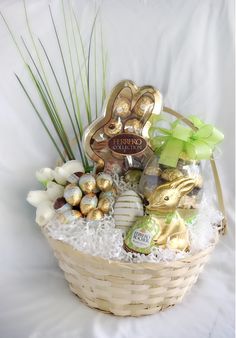 a basket filled with lots of different types of chocolates and candies in it