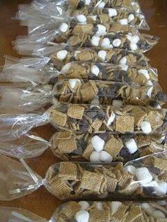 several bags of marshmallows are lined up on the table