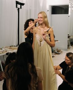 a group of women standing around each other