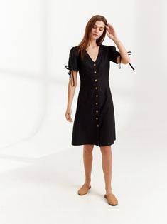 "MONICA is a knee length linen button down dress. DETAILS - Center front buttons - V neck - Knee length - Fitted bodice - No pockets - Oeko-Tex certified 100% lightweight linen - Cut and sewn to order just for you in our studio COLOR - Black, you can also choose other colors above - Fabric samples are available here https://www.etsy.com/listing/586569696/linen-fabric-samples SIZING & FIT - Fits true to size - Length (shoulder to hem) is approximately 39 inches / 99 cm - Bust approximately 33 Fitted V-neck Linen Dress With Buttons, Linen Dresses With Buttons For A Day Out, Spring Workwear Linen Dress With Buttons, Knee-length Cotton Midi Dress With Buttons, Chic Linen Button-up Dress, Chic Linen Dress With Button Closure For Day Out, Day Out Button-up Linen Dress, Fitted Linen Dress With Buttons, Chic Linen Day Dress With Buttons