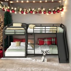 two bunk beds with christmas decorations and lights