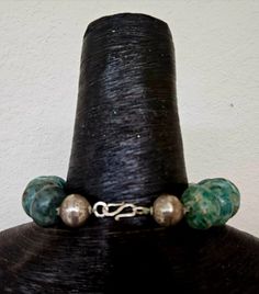 Just look at the size of these beads! These are called Guatemalita Jade and they are from Mexico. They range in size from the smallest (1.25") to the largest (2"). The necklace measures a non-adjustable 19" and closes with a hammered Artisan hook. Two etched sterling silver beads complete the back, and each bead is individually knotted for protection should breakage ever occur. I must stress that this is a very heavy piece so please know your tolerance before you buy. If requested, I can add a silver tone extender chain to make this more versatile. From the Atelier of Kat Kouture. Unique Round Faceted Beads Jewelry, Artisan Jewelry With Large Rondelle Beads, Bohemian Jewelry With Large Rondelle Beads, Handmade Artisan Rondelle Beads, Handmade Rondelle Artisan Beads, Artisan Chrysocolla Jewelry With Polished Beads, Photoshoot Jewelry, Hand-strung Jade Beaded Necklaces With Round Beads, Artisan Round Faceted Beads