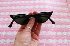 "RARE these are amazing! frame width=5.5\" arm width=5.5\" lens width=2\" Retro & Me loves these sunnies!! black sunnies one of a kind for sure great vintage condition for the age 1950s-1960s may have scratches and wear from storage all eyewear priced AS IS as found at estate sale perfect for pool parties love super retro! Thank YOU and please feel free to ask me any ?s:) Have a lovely day!! xoxo www.etsy.com/shop/retroandme #special" Vintage Cat Eye Sunglasses For Spring Party, Vintage Sunglasses With Tinted Lenses For Party, Vintage Sunglasses With Uv Protection For Parties, Retro Polarized Sunglasses For Party, Vintage Tinted Sunglasses For Party, Retro Cat Eye Sunglasses For Summer Party, Vintage Tinted Sunglasses For Parties, Vintage Cat Eye Sunglasses With Mirrored Lenses For Spring, Vintage Cat Eye Sunglasses For Spring