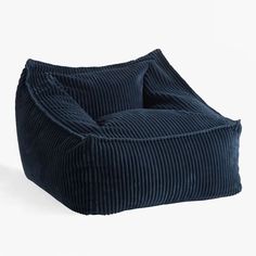 the bean bag chair is made out of dark blue cordy fabric and has a rounded shape