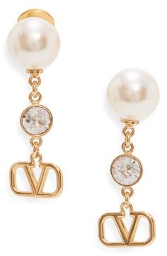 These gorgeous drop earrings add a touch of sophisticated movement to your look with imitation-pearl studs suspending a chain with crystal and VLOGO accents. Post back Goldtone plate/imitation pearl/crystal Made in Italy Pearl Crystal, Crystal Drop Earrings, Crystal Drop, Pearl Studs, Valentino Garavani, Gold Tones, Jewelry Earrings, Nordstrom, Women Jewelry