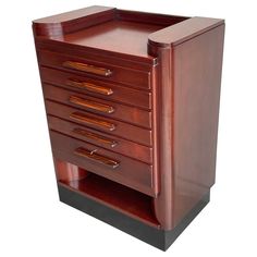 a brown wooden cabinet with five drawers