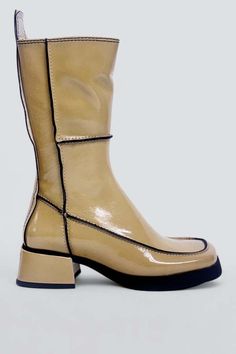 Beige alzira boot from miista. the mid-calf platform silhouette flirts with the 1970s before looking to the future. features contrast navy stitching alongside patent shiny leather. set on a raised sole with a statement boot-pull tab and inner zip. memory foam insoles enhance comfort. the calves run slightly small. if you're between sizes we recommend sizing up.    -made in portugal    - heel height: 1.75" Leather Boots Outfit, Layering Jacket, Boot Pulls, Eyewear Shop, Brown Oxfords, Patent Leather Boots, Vintage Swimwear, To The Future, Girls Boots