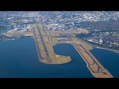 an aerial view of the runway and surrounding city area from above, looking down on it's landing strip